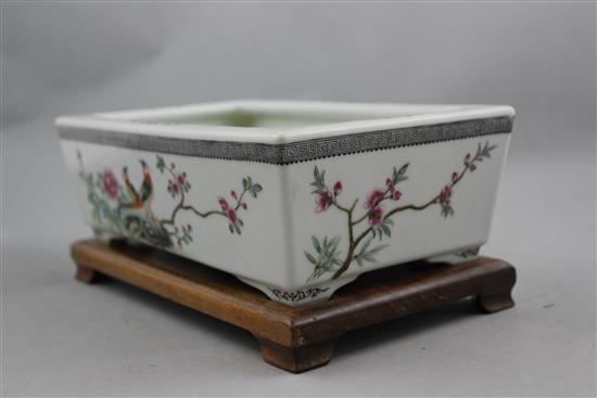 A Chinese famille rose rectangular narcissus bowl, Qianlong mark, Republic period, 24.5cm, wood stand